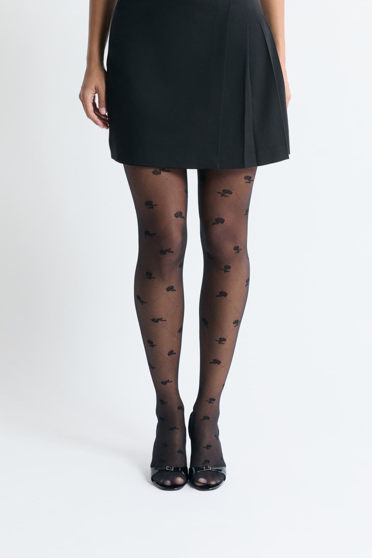 Collant transparent à motifs fleurs in black, front view on model - Etam