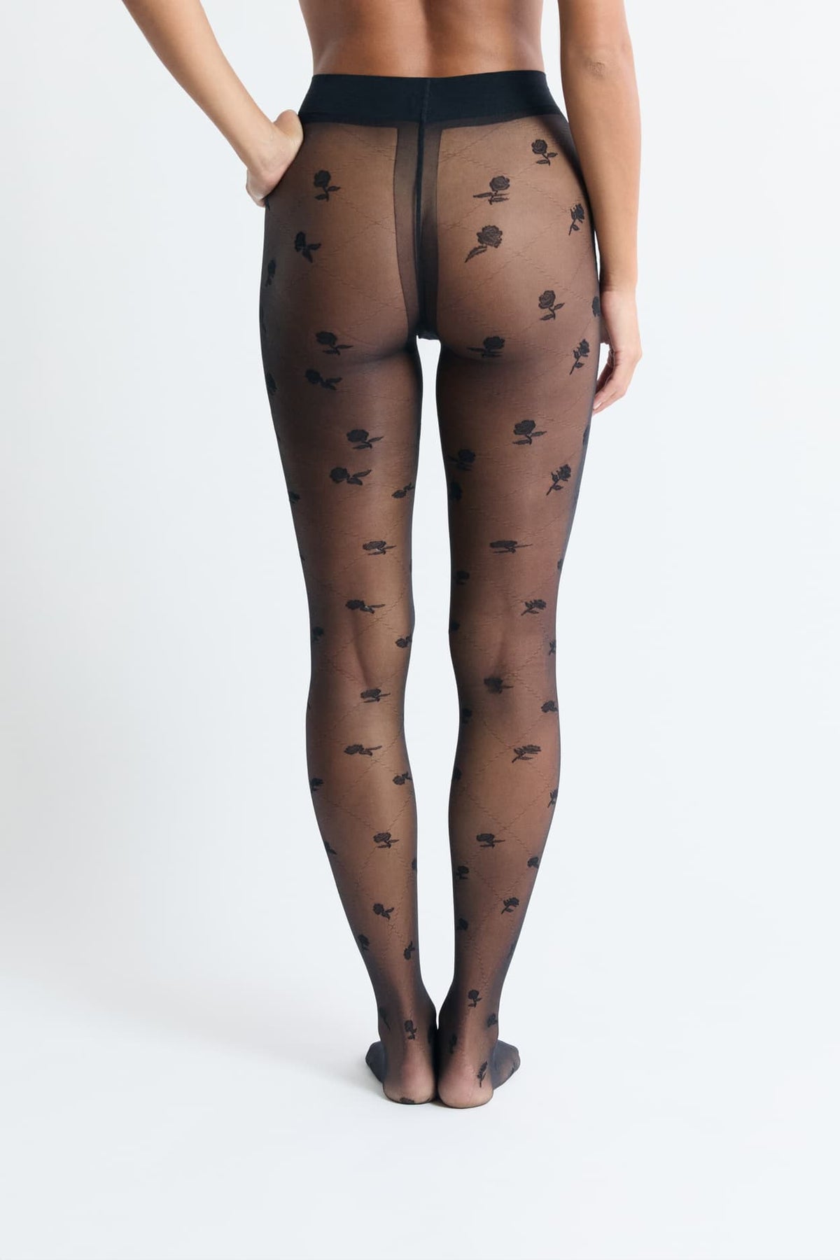 Collant transparent à motifs fleurs in black, back view on model - Etam